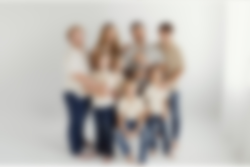 Children laughing during a family portrait session