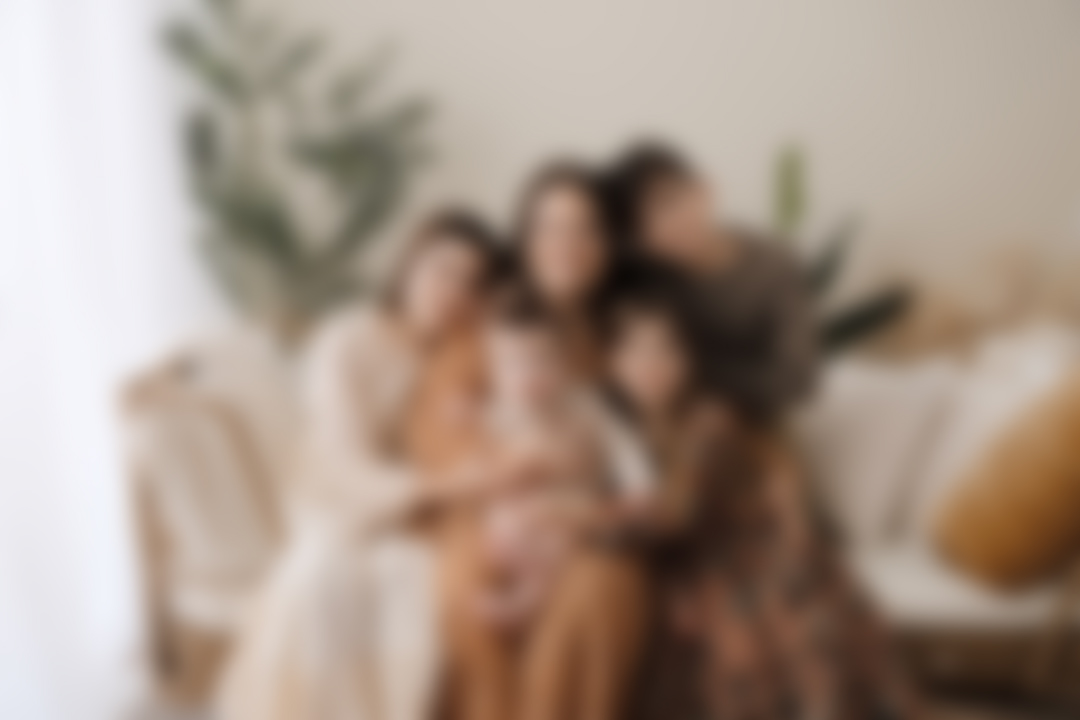 Family wearing coordinated outfits for a portrait session