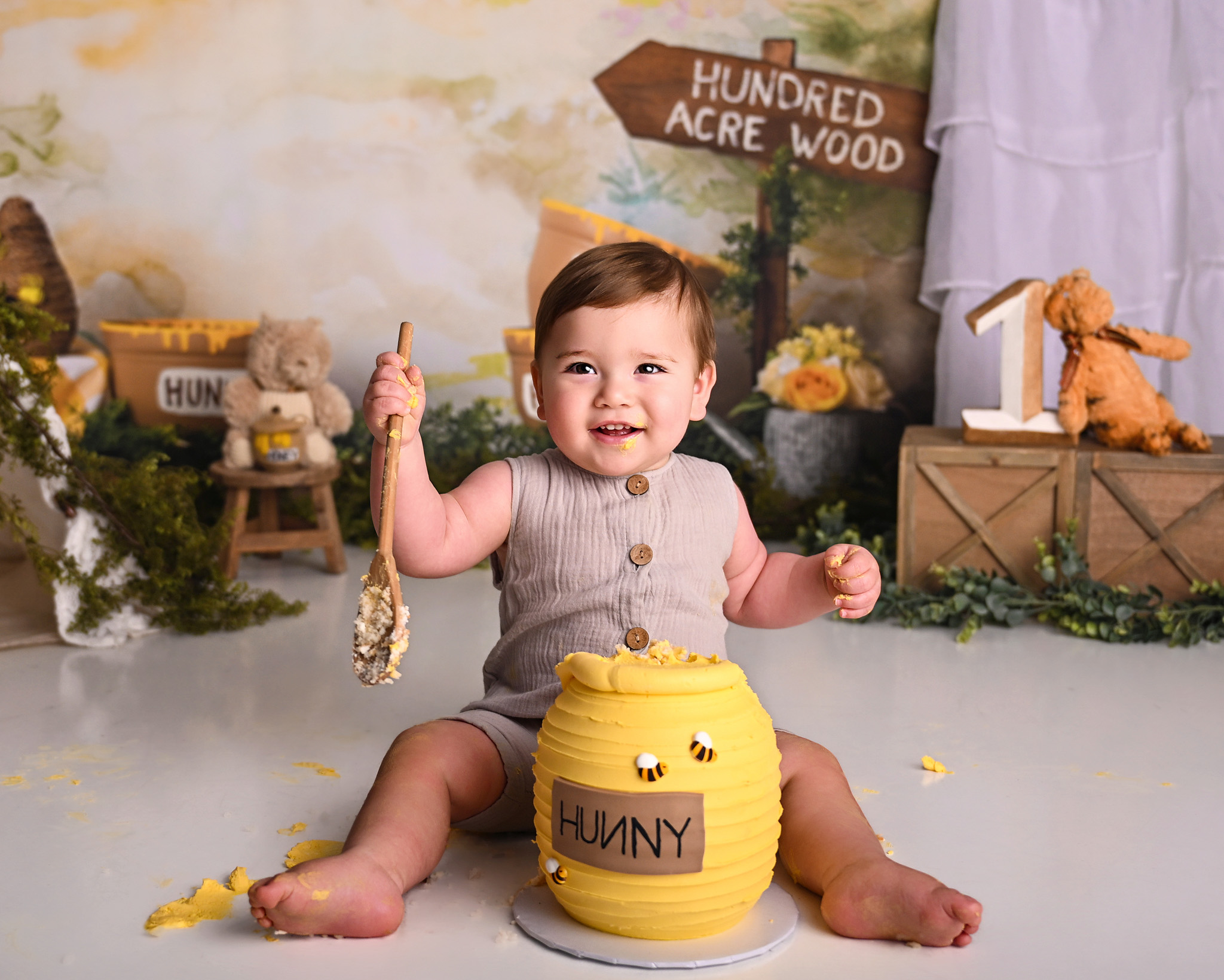 Cake smash baby having fun during a photography session in Tempe, AZ. Olivia Grace Photography Studio