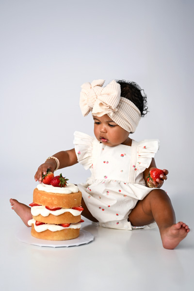 One year old baby at a cake smash session