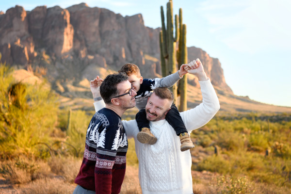 Family embracing at golden hour