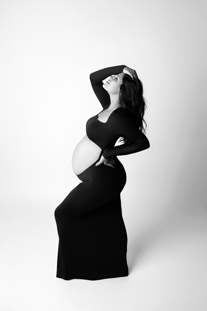 Pregnant woman in a flowing maternity portrait