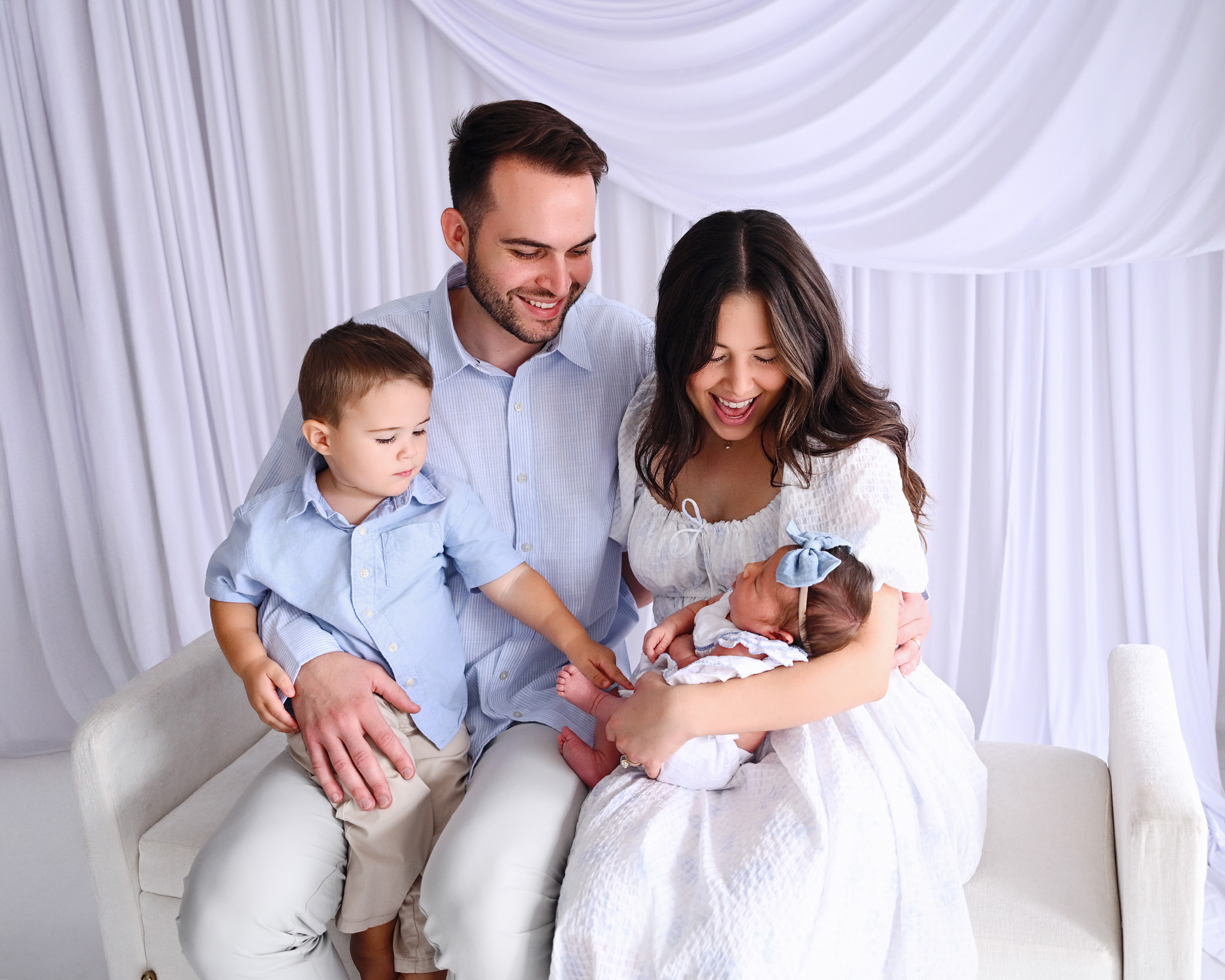 Family together with a newborn baby