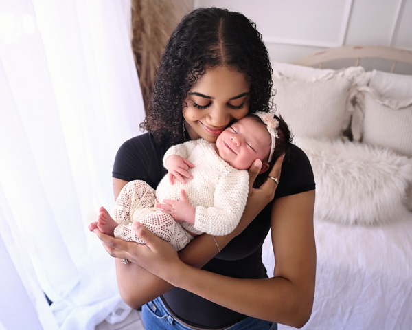 Newborn baby in a handmade knit outfit