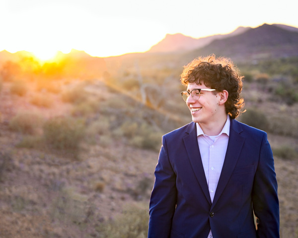 Confident senior portrait with gentle styling